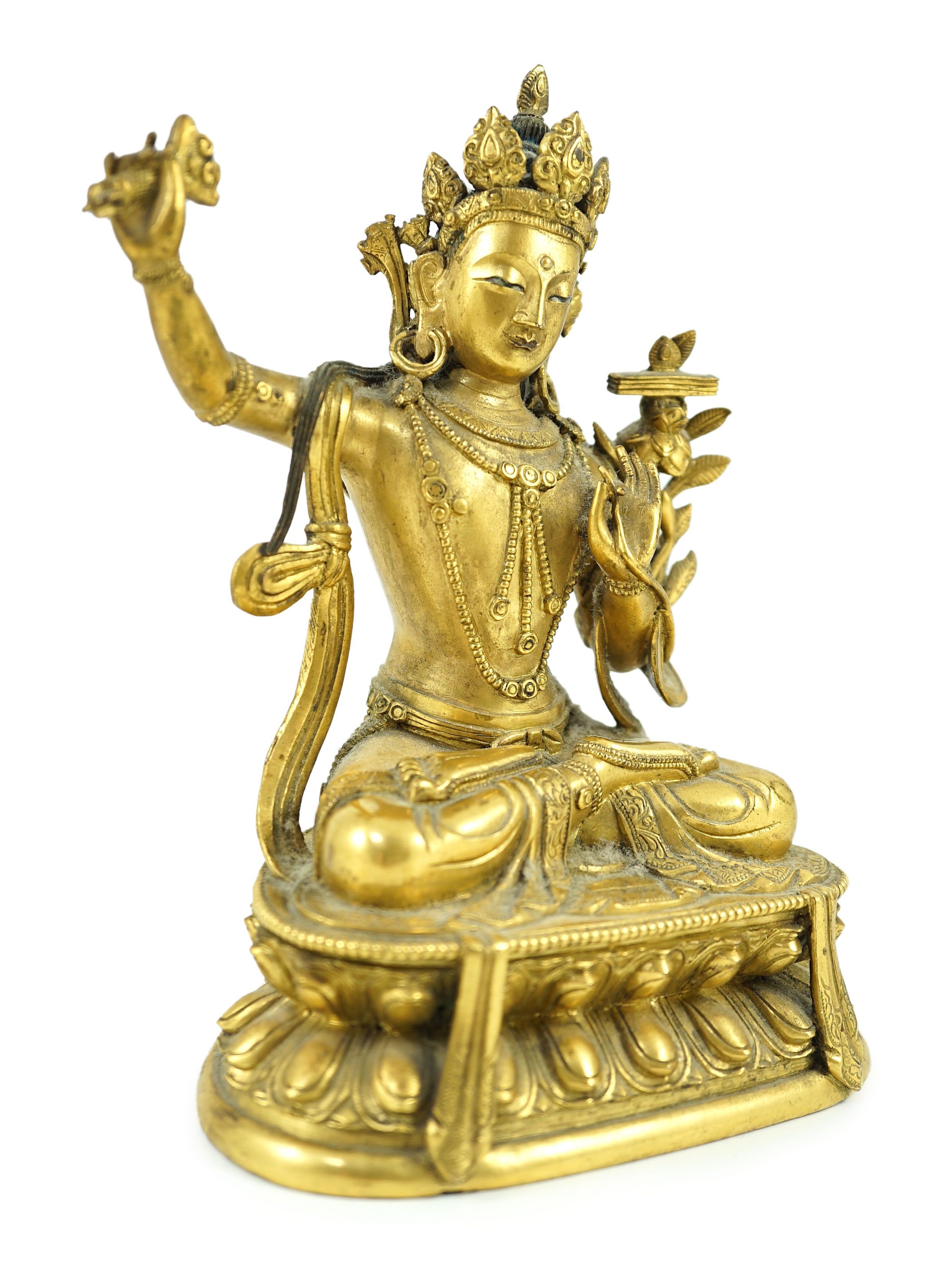 A Tibetan gilt bronze seated figure of Vajrasattva, 16.5 cm high
